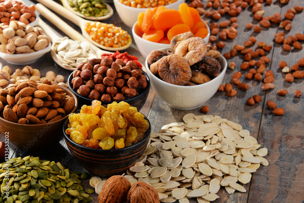 Composition with dried fruits and assorted nuts - obrazy, fototapety, plakaty 