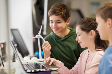Wall Mural - children with laptop and wind turbine at school