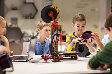 Wall Mural - happy children with 3d printer at robotics school