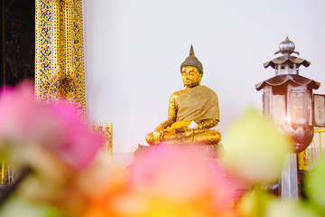 Buddha statue with thai art architecture in church Wat Suthat temple. This is a Buddhist temple in Bangkok .