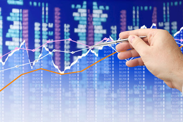 Fototapete - Businessman analyzing financial chart on virtual screen