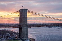 Colorful Sunset Behind Brooklyn Bridge, Manhattan New York City