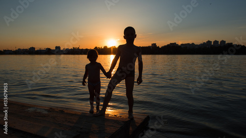 Boy And Girl Holding Hands At Sunset Silhouette Frame Stock Photo Adobe Stock Boy And Girl Holding Hands At Sunset Silhouette Frame Stock Photo Adobe Stock