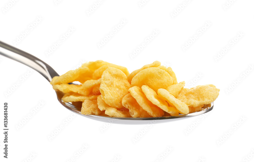 Spoon with cornflakes isolated on white