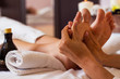 Massage of human foot in spa salon - Soft focus