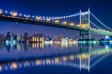 Beautiful Night View With Lights Of Robert F. Kennedy RFK Bridge Formerly Known As The Triborough Bridge From Astoria Queens Across The East River Toward New York City Upper Manhattan Skyline
