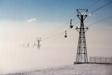 Cableway On Foggy Landscape