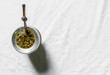 Yerba mate tea in a calabash gourd against white background. Selective focus