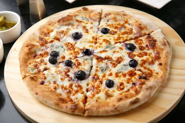 blueberry pizza on table