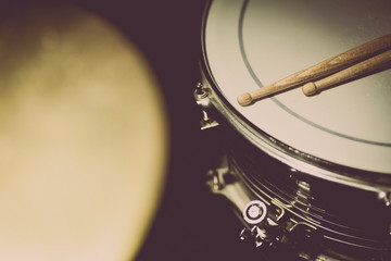 Snare drum and a pair of drum sticks