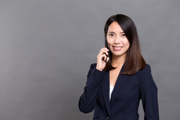 Wall Mural - Businesswoman talk to cellphone