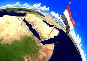 Yemen national flag marking the country location on world map. 3D rendering, parts of this image furnished by NASA