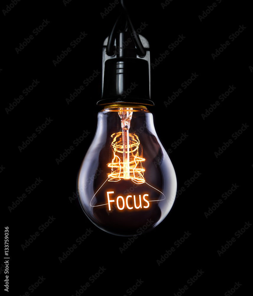 Hanging lightbulb with glowing Focus concept. - obrazy, fototapety, plakaty 