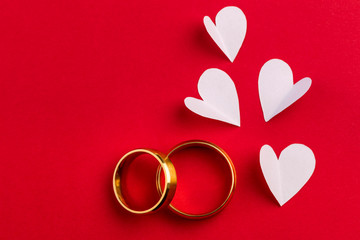 Love  background - two gold wedding rings and handmade hearts de