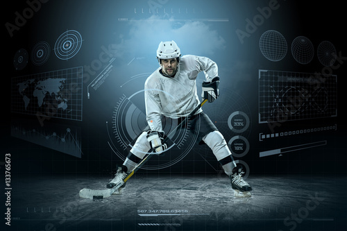 Fototapeta na szkło Ice hockey player on the ice around modern light