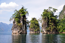 Limestone  Cliffs Rising Out Of  Lake At Khao Sok National Park, Thailand
