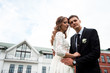 © dashamuller - gorgeous happy wedding couple walking and kissing in the old city of Minsk, Belarus