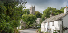 Street View With An Old Cottage And The Church In The Picturesque Village Altarnun In North Cornwall.