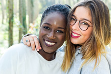 Diverse Portrait Of Two Attractive Teen Girlfriends Outdoors.Face Shot Of Black Girl With White Friend.
