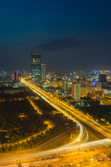 Aerial skyline view of Hanoi cityscape at twilight. Thang Long freeway and Pham Hung street