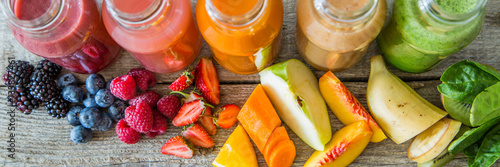 Cuadros en Lienzo Selection of colorful smoothies on rustic wood background