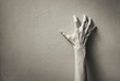 © kieferpix - Hand clawing up a wall. Frustration, and anger concept.