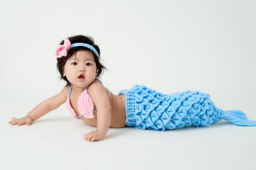 baby girl with cute mermaid outfit and white background