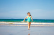 © Alena Yakusheva - young happy child girl having fun on sand beach, sea background