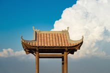 Asian Oriental Buddhism Temple Roof Against Blue Cloudy Sky