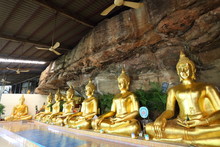 Golden Buddha Statue In Wat Tham Khuha Sawan At Ubon Ratchathani, Thailand