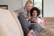 © .shock - couple relaxing at  home with tablet computers