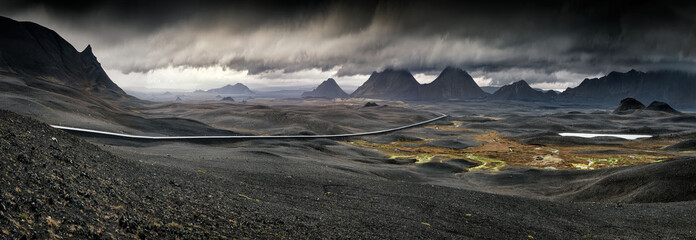 myvatn, iceland - long winding road through volcanic landscape