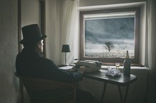 Vintage Novel Writer Is Looking Out Of Window At Lonely Winter Tree