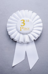 Wall Mural - third placed white ribbon rosette on grey