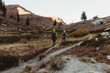 © Connect Images - Rear view of two male hikers hiking up rugged landscape, Mineral King, Sequoia National Park, California, USA