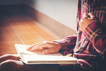 man praying on holy bible in the morning