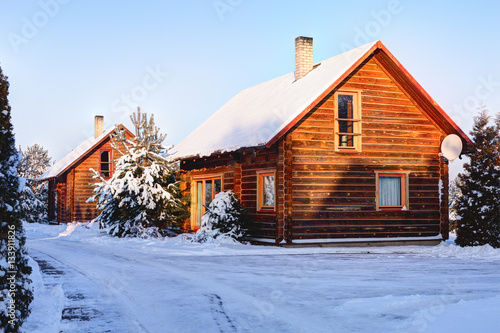 Traditional Wooden House In The Snow Winter In Europe Lithuania
