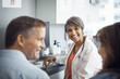 © Cavan Images - Happy female doctor looking at patient in clinic