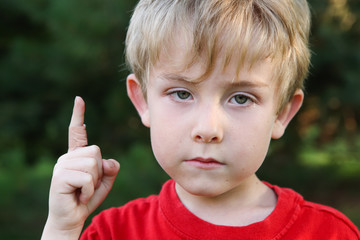 Wall Mural - Sad boy with a bandaged finger