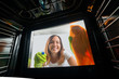© Andrey Popov - Woman Cleaning The Glass Door Of Oven