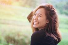 Asian Woman Smiling With Perfect Smile In The Green Nature