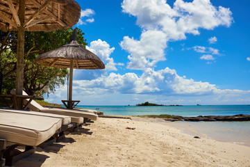 Canvas Print - White sand beach with lounge chairs and umbrellas in Mauritius I