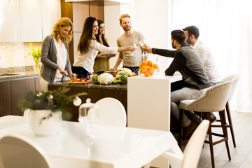 Friends toasting with white wine joyous event