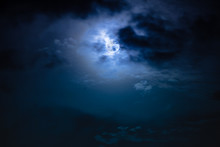Nighttime Sky With Clouds And Bright Full Moon With Shiny.