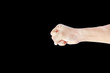 © zilvergolf - A hand shows in signal of hammer or rock on black background.