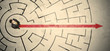 © ra2 studio - Business person standing in the middle of a circular maze