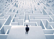 © ra2 studio - Businessman staring at infinite maze