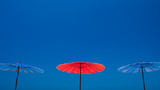 Fototapeta Tęcza - Beach umbrella against the sky.