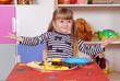 Three-year girl playing and learning in preschool