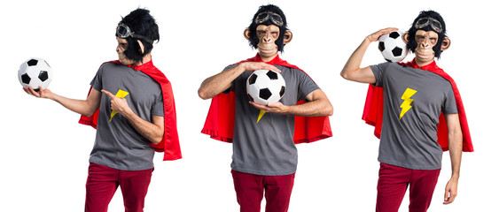 Wall Mural - Superhero monkey man holding a soccer ball